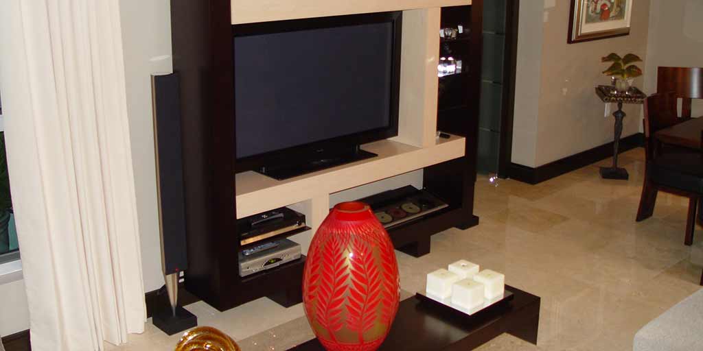 Installation of Bang & Olufsen BeoVision 4 50" on table stand with hidden cables, in Dadeland. By dmg Martinez Group.