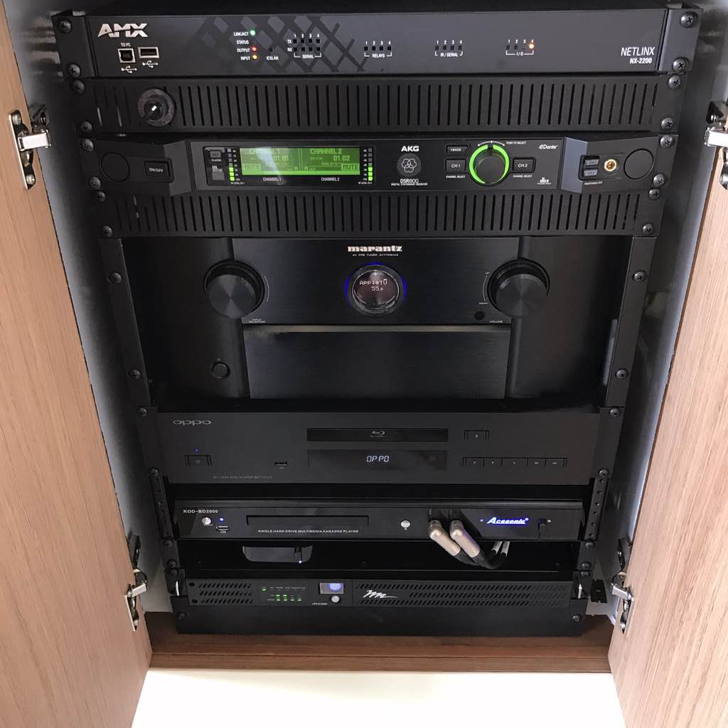 Custom marine installation of Pull-Out and Rotating rack holding premium AV equipment, in Coconut Grove, FL. By dmg Martinez Group.